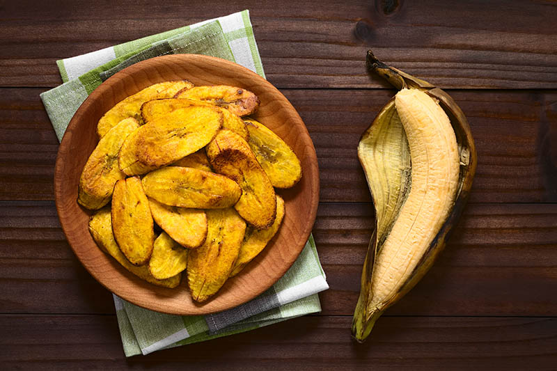 whole plantain and a fried plantain sliced