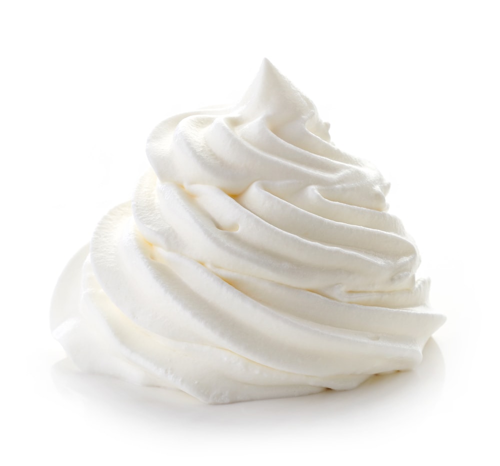 Whipped cream isolated on white background