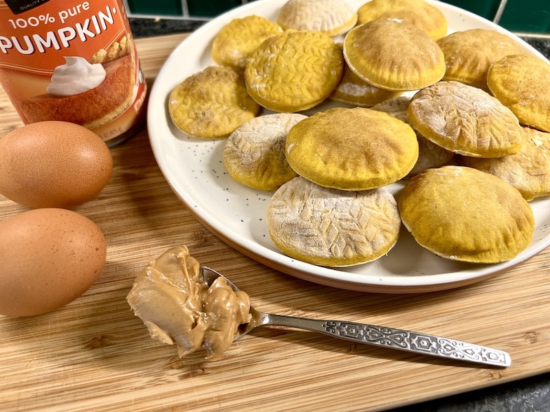 homemade pumpkin peanut butter dog treats finished and with ingredients