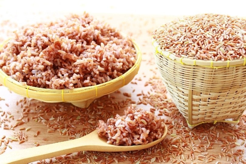 brown rice on wooden ladle