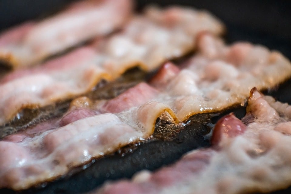 close up frying bacon
