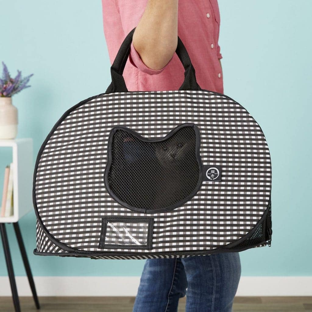 cat inside Necoichi Ultra Light Collapsible Cat Carrier Bag