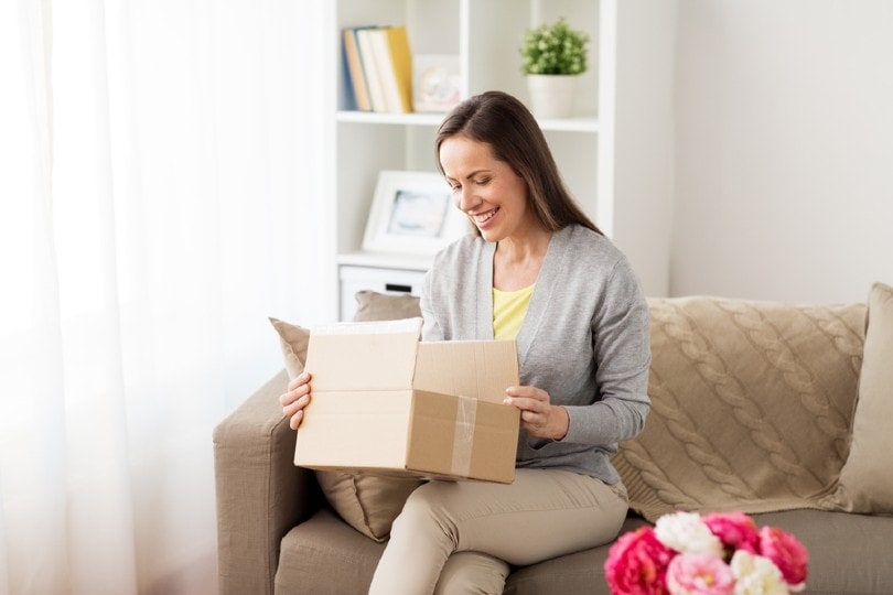 woman opening package