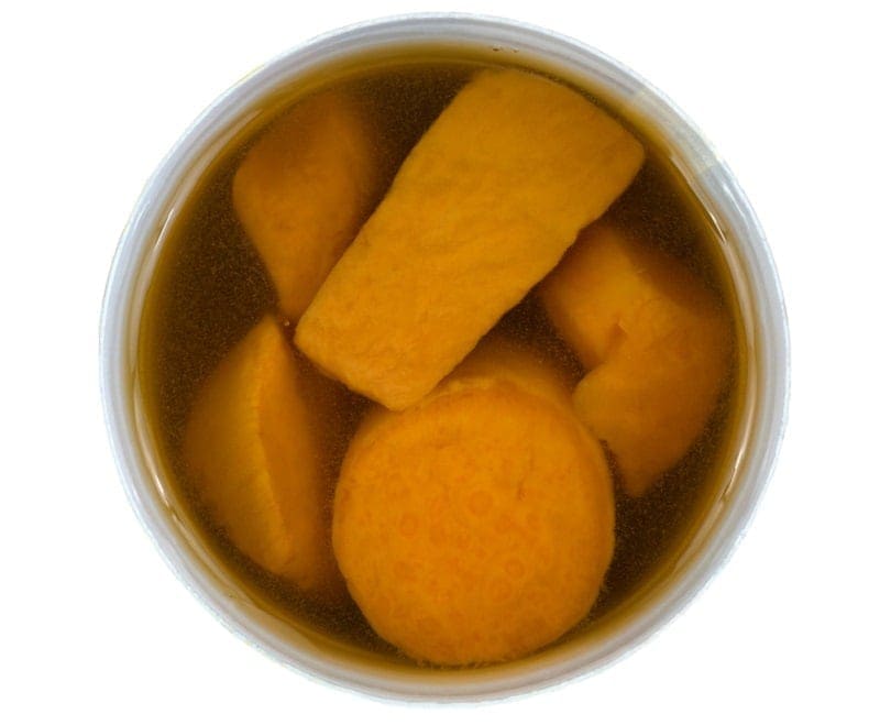 A top view of a can of naturally moist and tasty canned yams