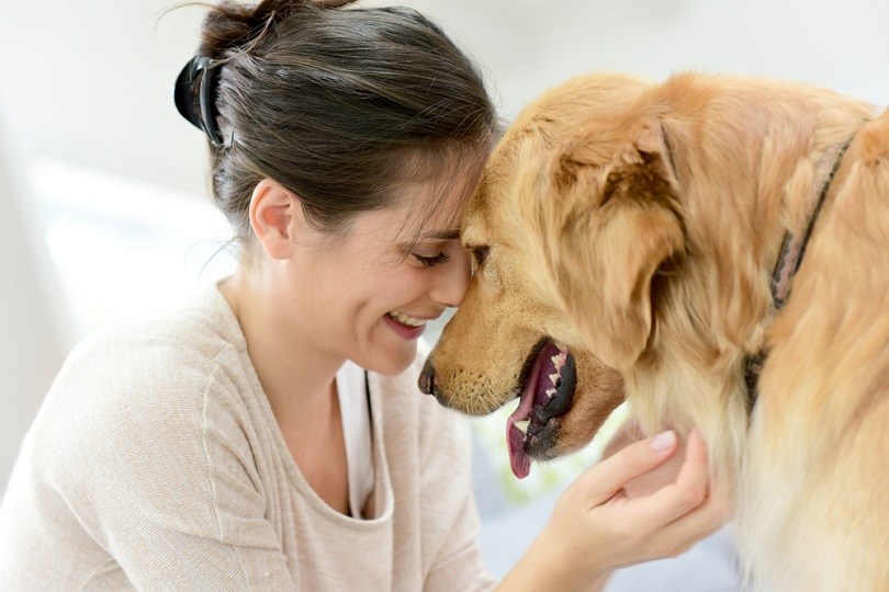 Portrait of woman with dog_goodluz_shutterstock