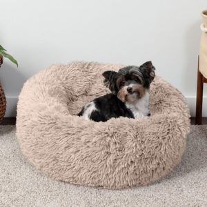 dog in FurHaven Calming Cuddler Long Fur Donut Bolster Dog Bed