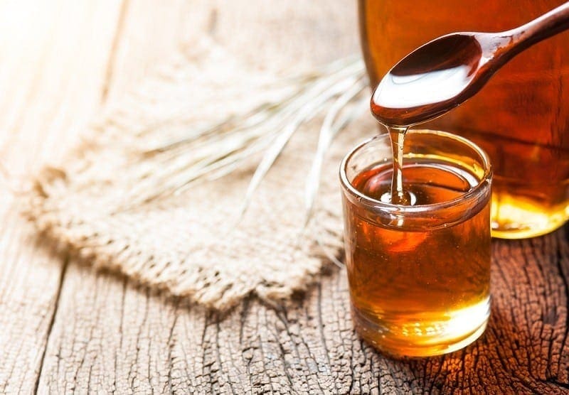 maple syrup in glass bottle_showcake_shutterstock