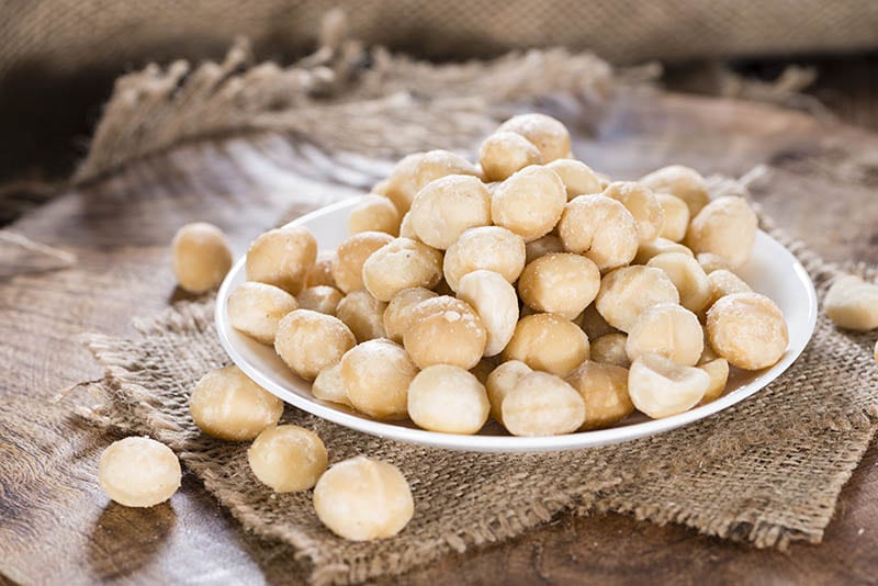 peeled macadamia nuts on a plate