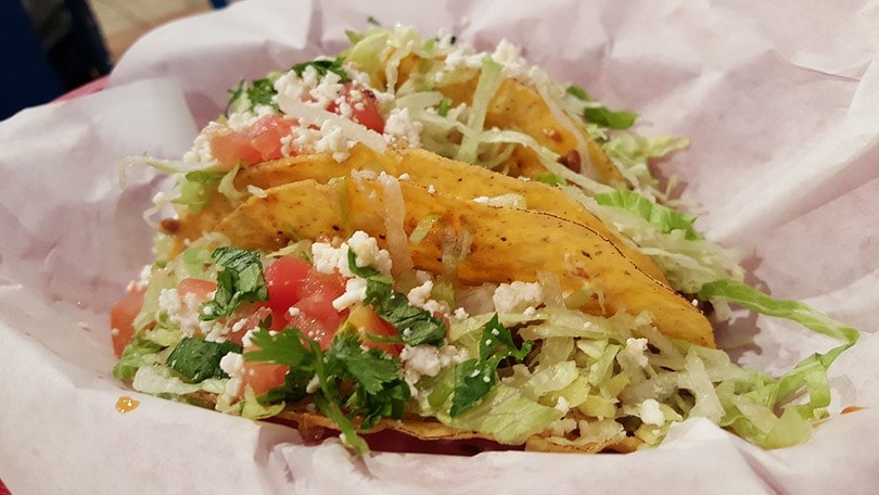 tacos on plate with paper