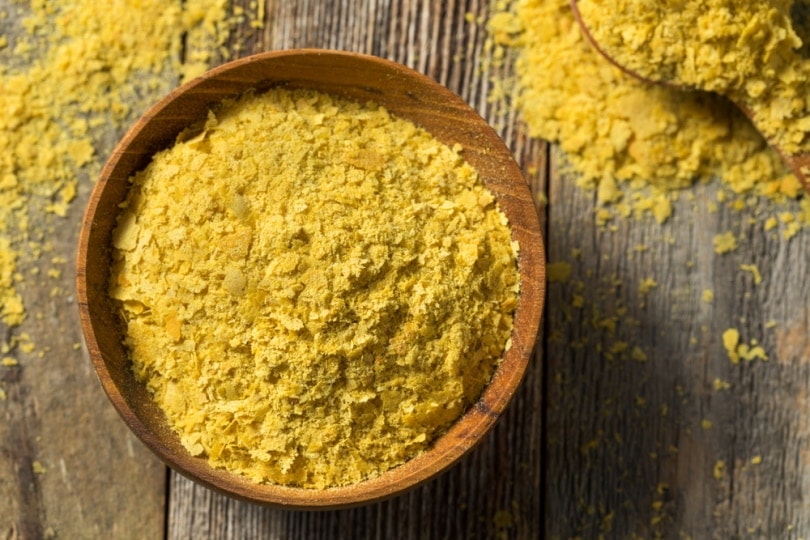 Nutritional yeast in a wooden bowl
