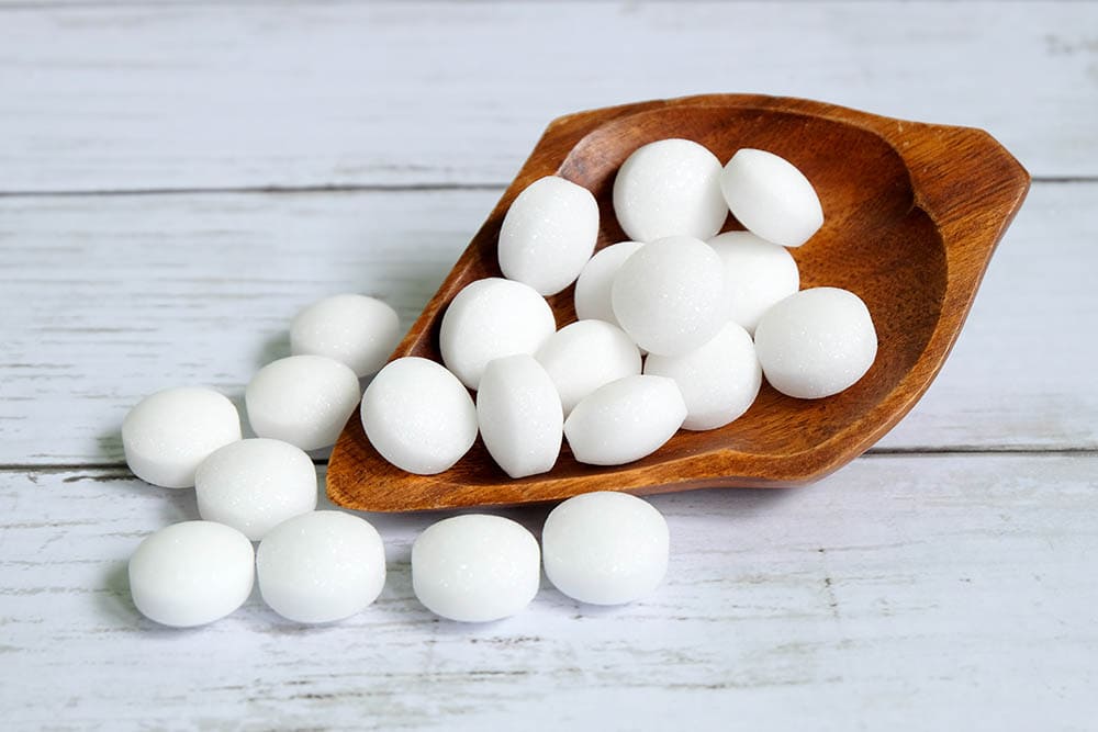 mothballs in wooden bowl