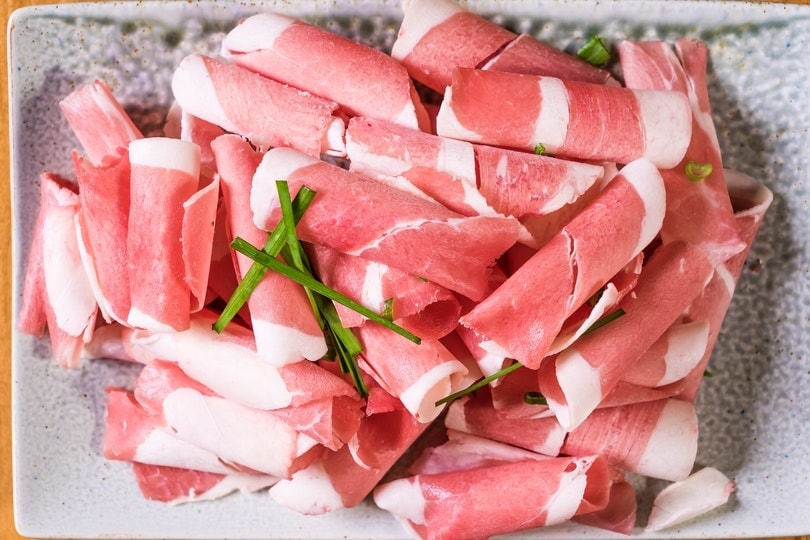 raw slices of prosciutto