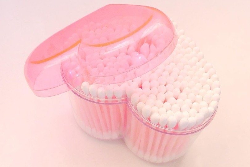 cotton buds in a pink heart-shaped container