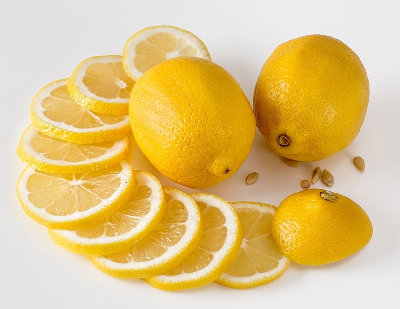 sliced and whole lemons