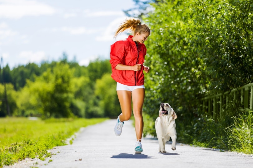woman running with her dog