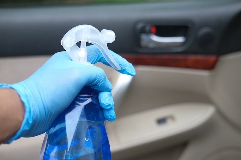 spray bottle and gloves to clean inside of car