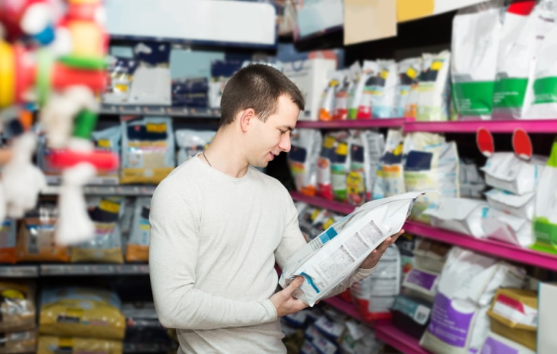 man buying pet food