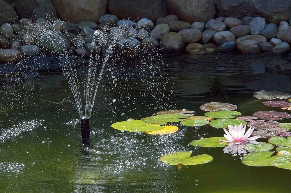 A pond with a sprinkler