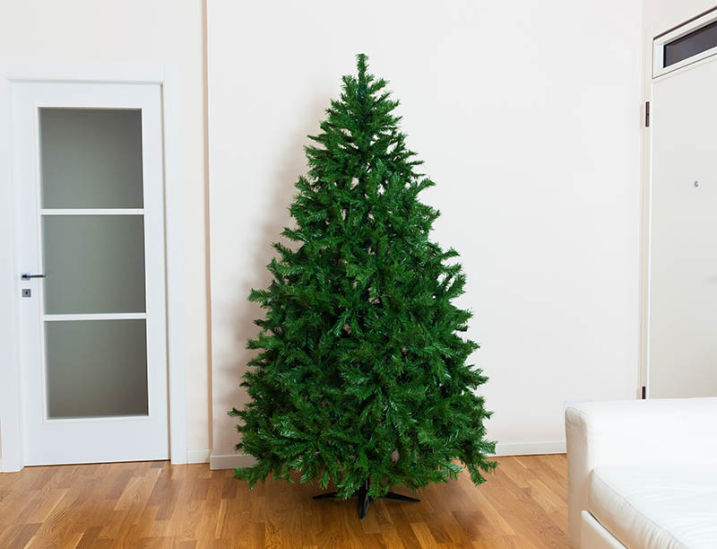 Bare artificial christmas tree in the house