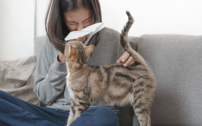 sick woman with a cat on her lap