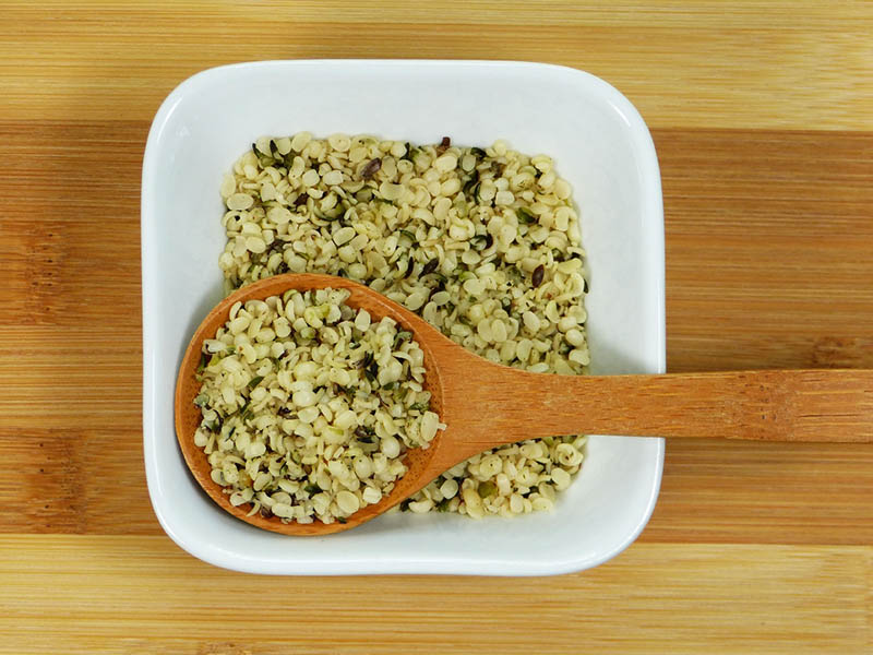 spoonful of hemp seeds on a bowl