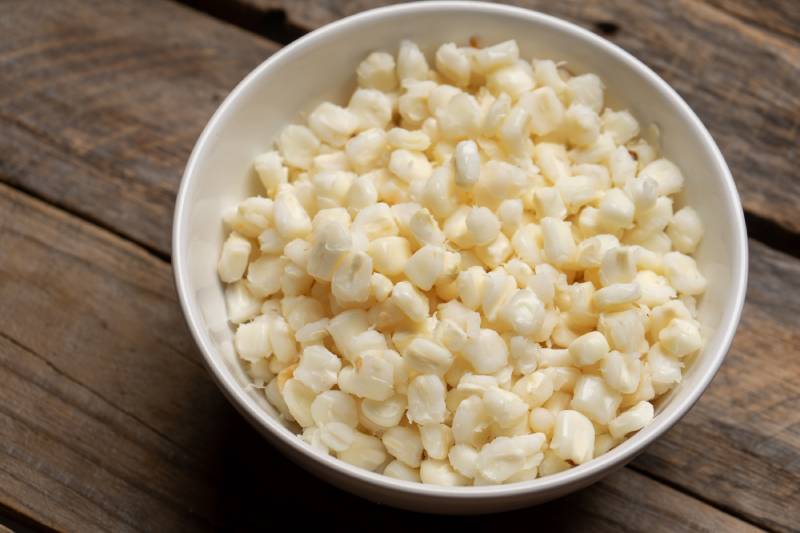 white hominy for traditional mexican pozole on wooden background