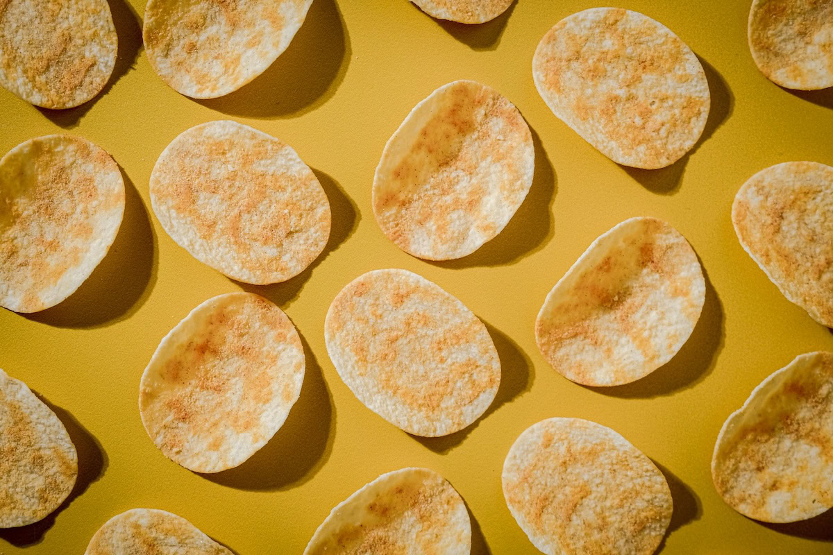 Pringles chips spread out on yellow