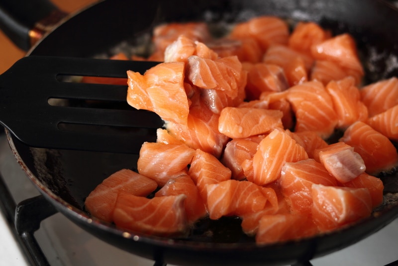 Diced salmon grilled in a skillet Diced salmon grilled in a skillet