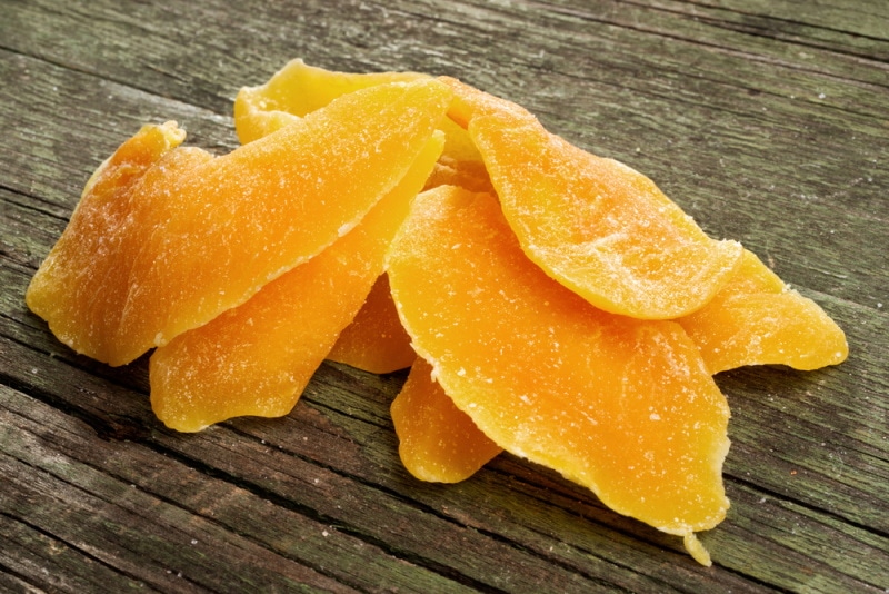 dried mangos in wooden background