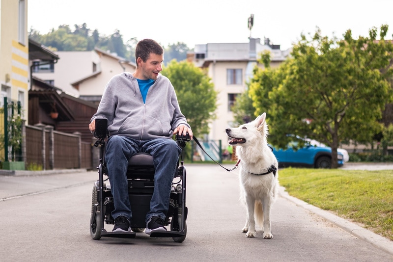 man with disability and his service dog