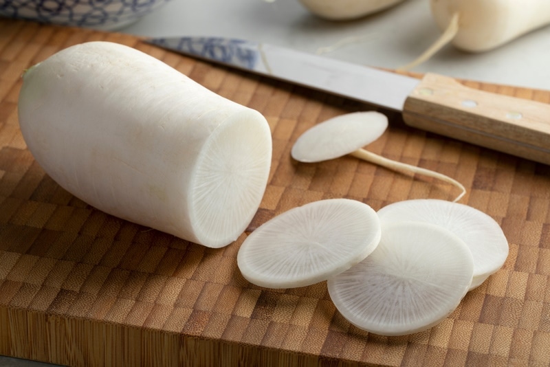 white daikon radish on wooden table