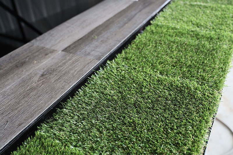 A green artificial natural grass which may make a fresh environment condition at home