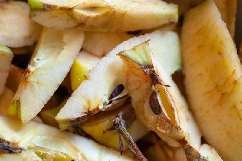 a pile of cut apple cores