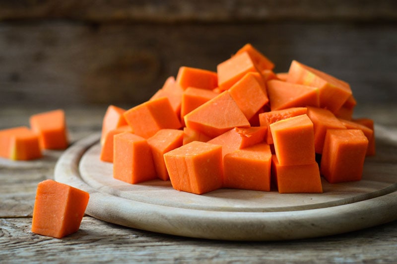 diced pumpkin on wooden board