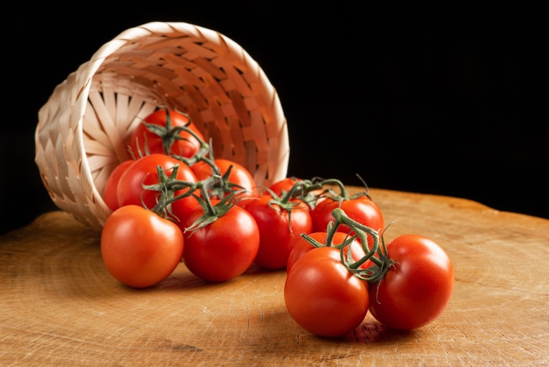 fresh tomatoes in wooden table