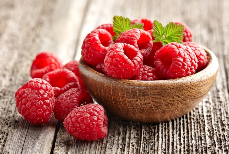 raspberries on wooden table