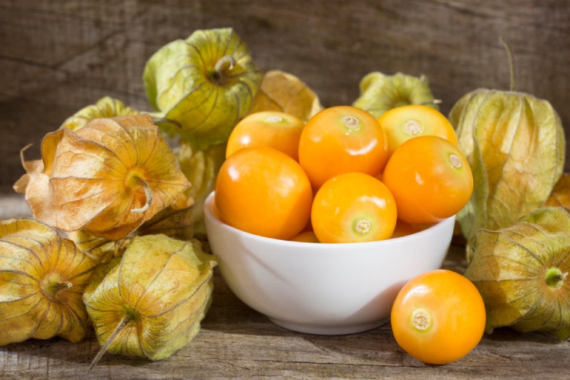 beautiful golden berries in a white bowl