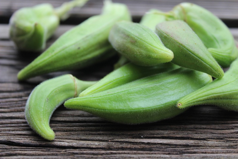 okras on wooden surface