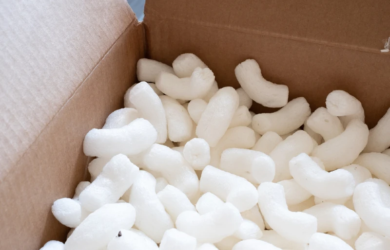 biodegradable packing peanuts in a cardboard box