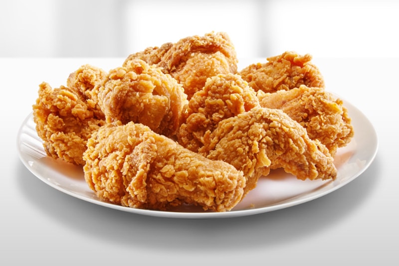 crispy fried chicken on a white plate