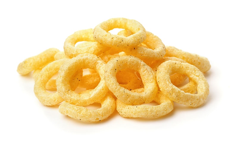 Pile of crispy onion rings isolated on white