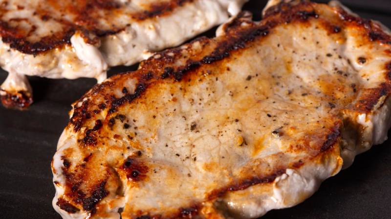 cooked pork chop on a grilling pan