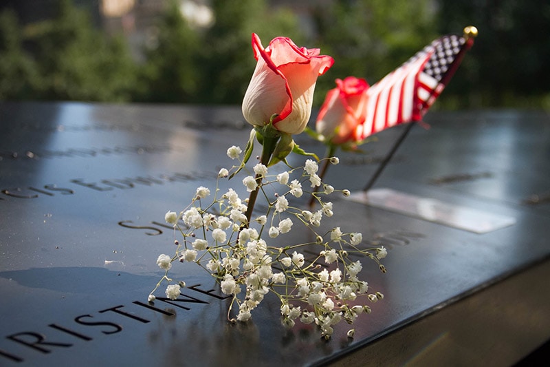 flag and flower at the 911 memorial