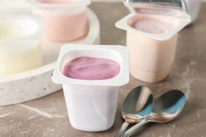plastic cups with yogurt