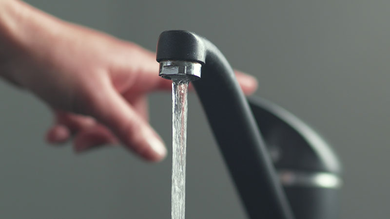 tap water flowing from the faucet