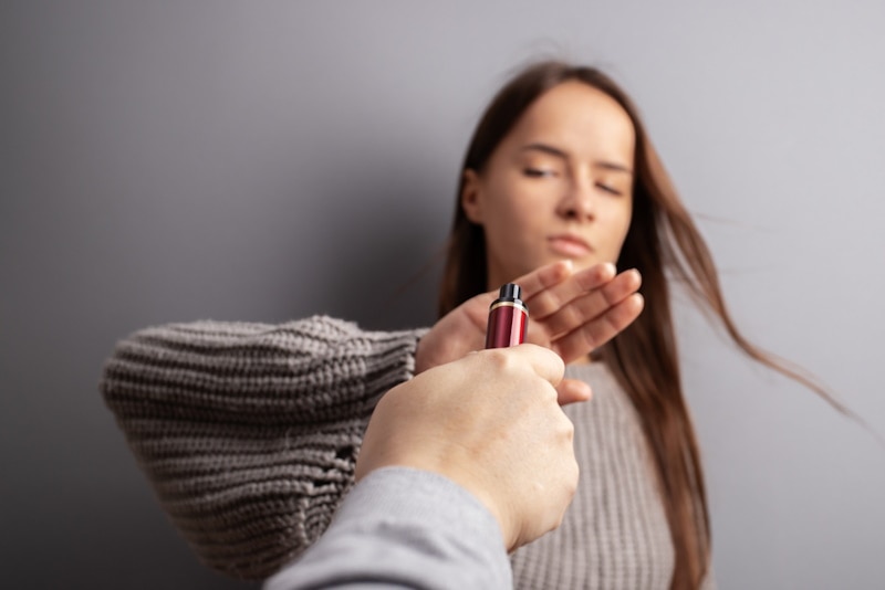 Woman refusing vape from a man