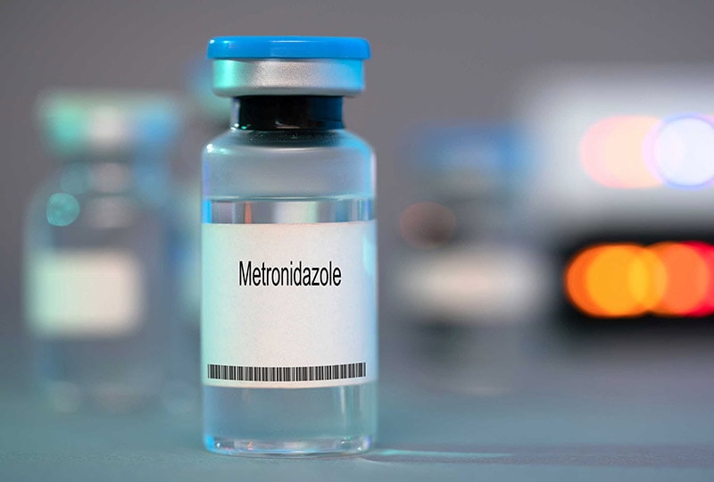 a glass vial of metronidazole