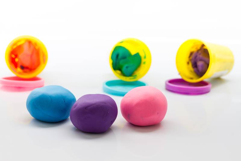 Play-Doh or plasticine clay on white background