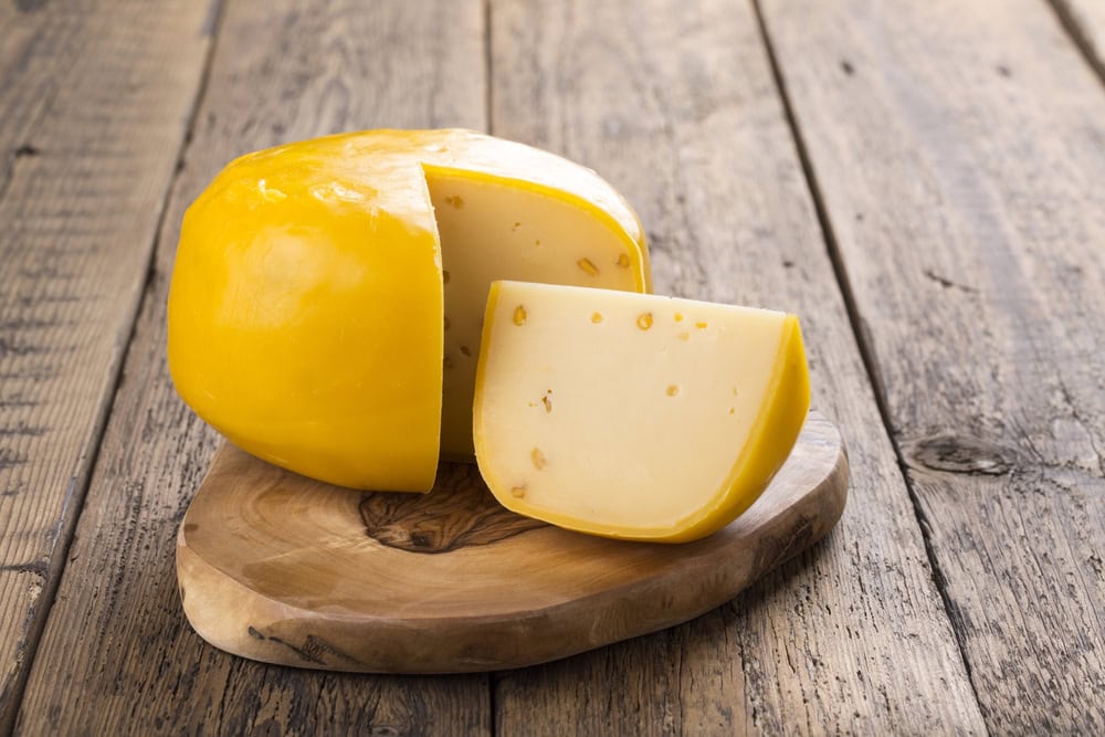 gouda-cheese-on-wooden-background