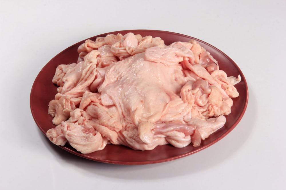 raw chicken skin on a plate